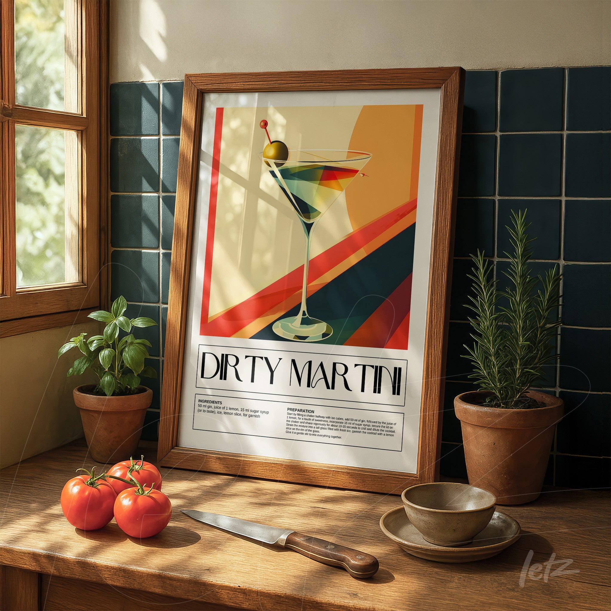 vintage style framed art of dirty martini in light wooden frame displayed on wooden countertop next to potted plants