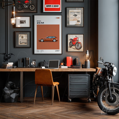 framed artwork featuring an illustration of a BMW Z3 M car on the gray wall, surrounded by other art pieces and photos in a vintage setting with a wooden desk and black motorcycle