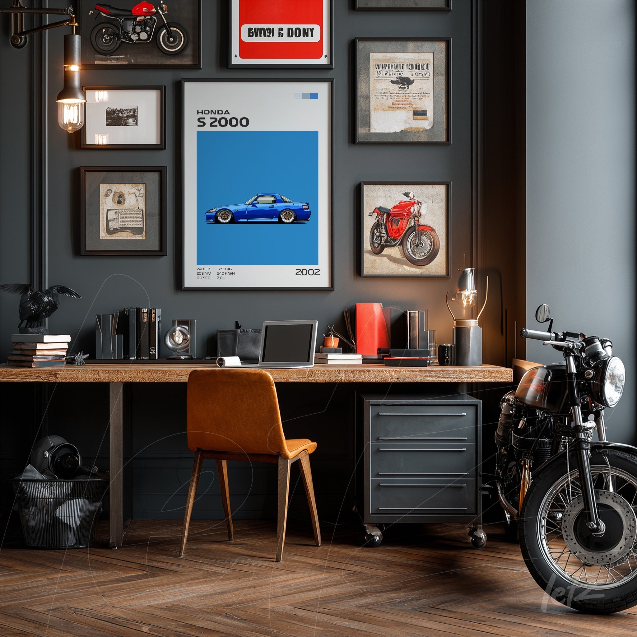 decorated space with vintage car and motorcycle prints on gray wall, light wood desk with orange chair, and motorcycle displayed beside