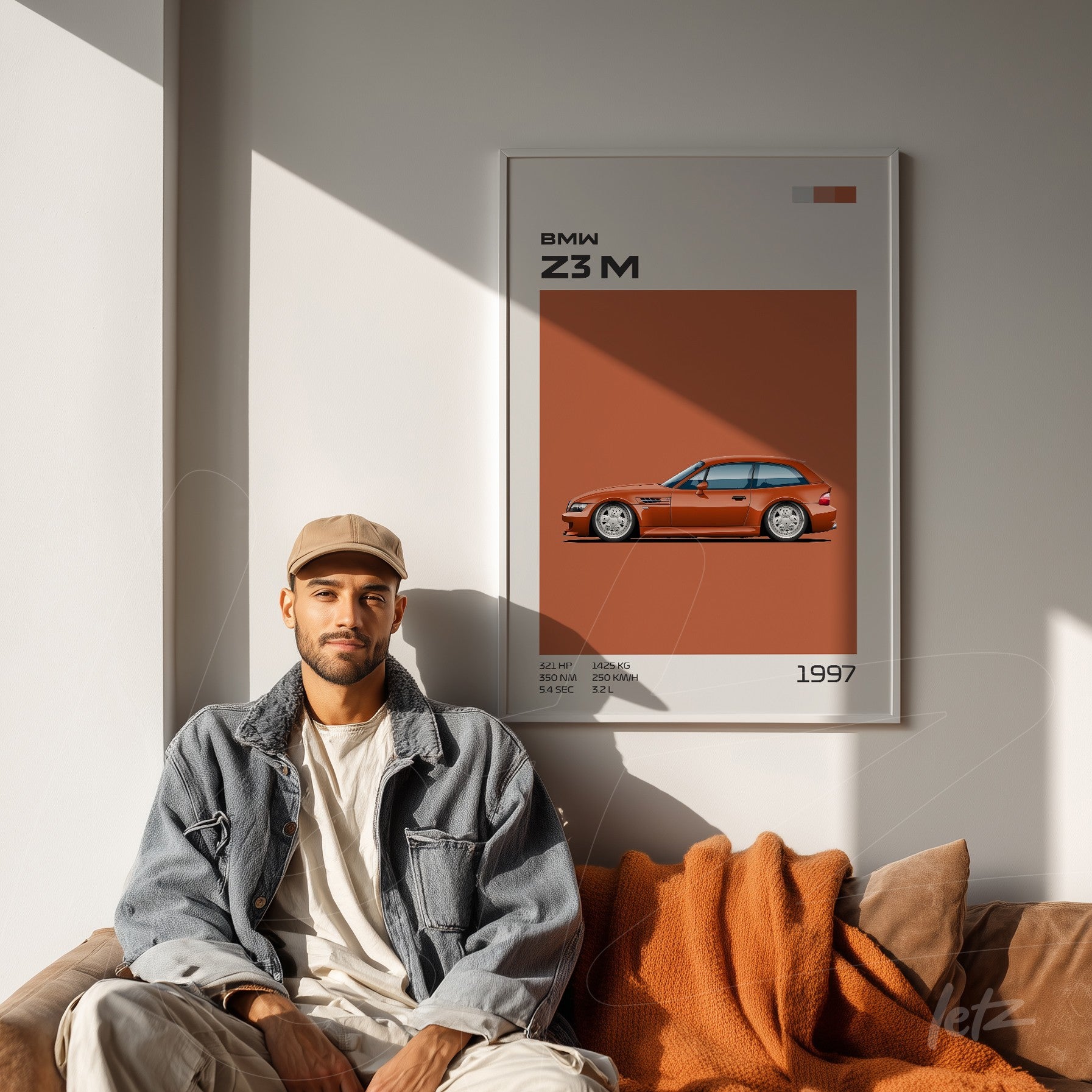 modern artwork featuring BMW Z3 M in white frame displayed next to a man sitting on a brown sofa
