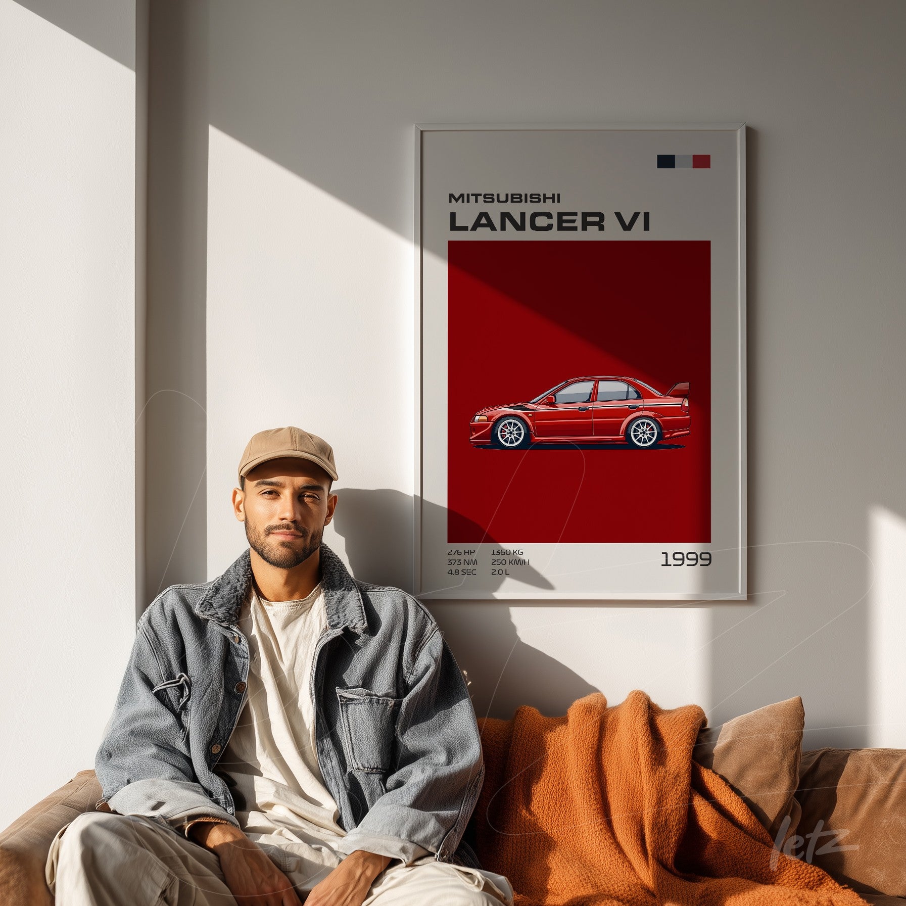 framed artwork of Mitsubishi Lancer VI car in white frame displayed on light wall with a person sitting on a sofa