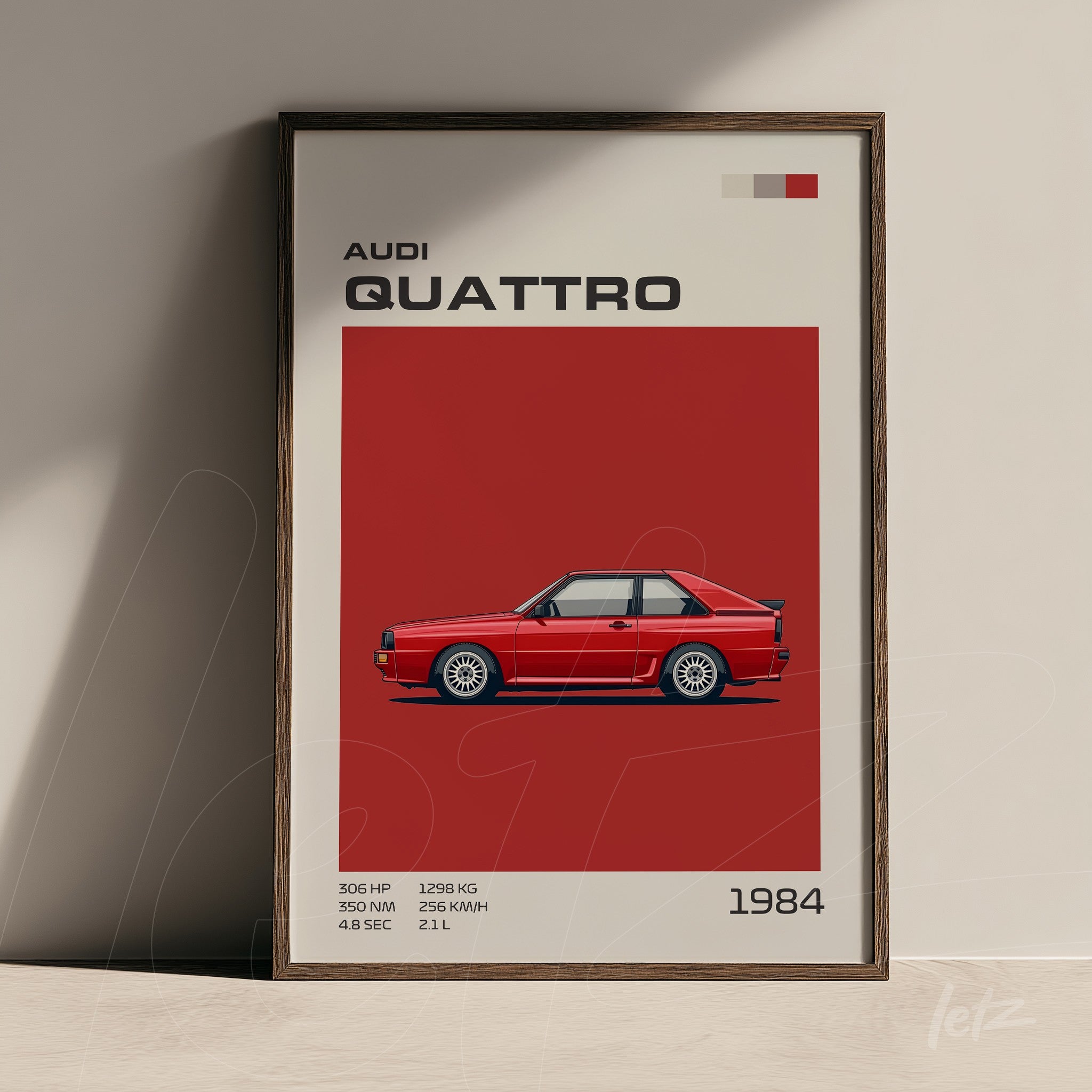 framed artwork featuring the Audi Quattro from 1984 with red background and informative text