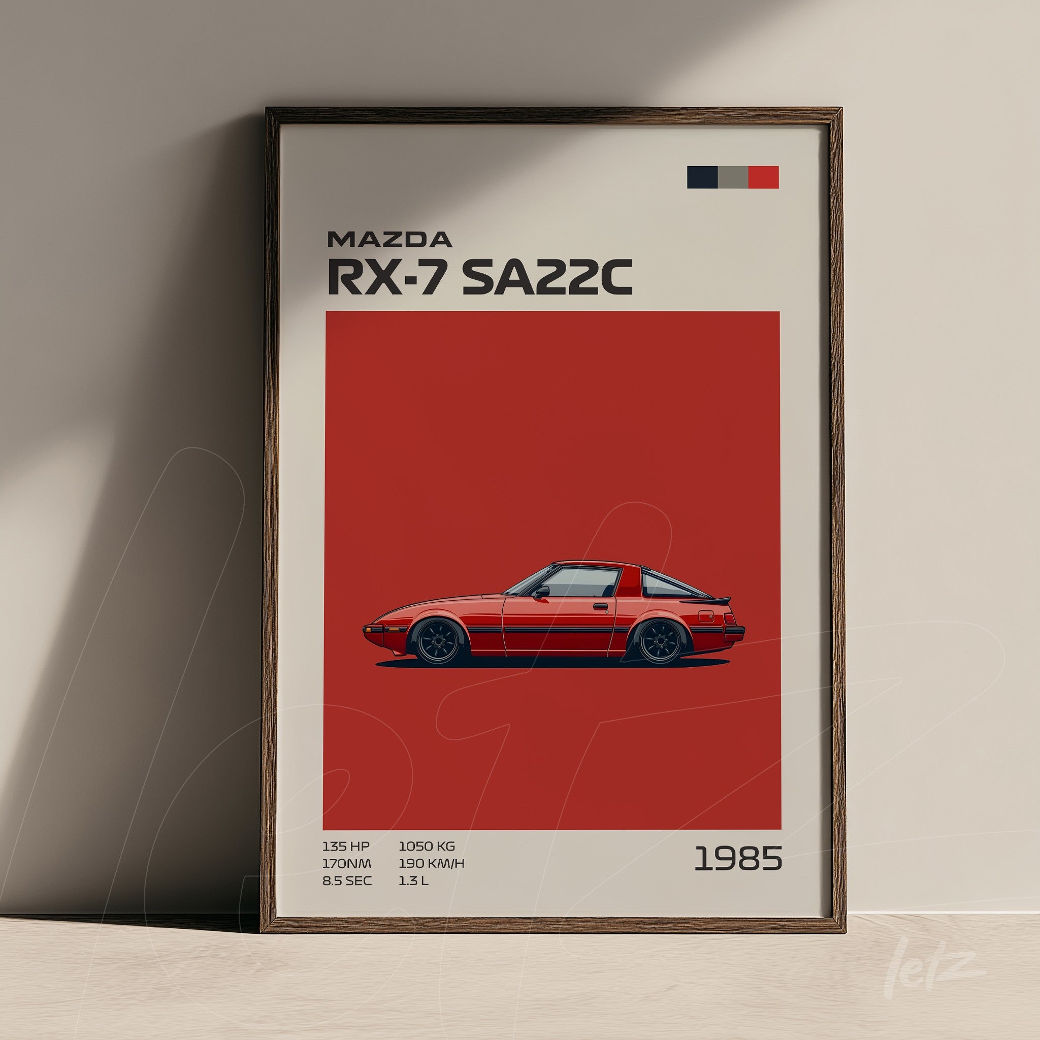 framed illustration of Mazda RX-7 SA22C on red background with dark wooden frame
