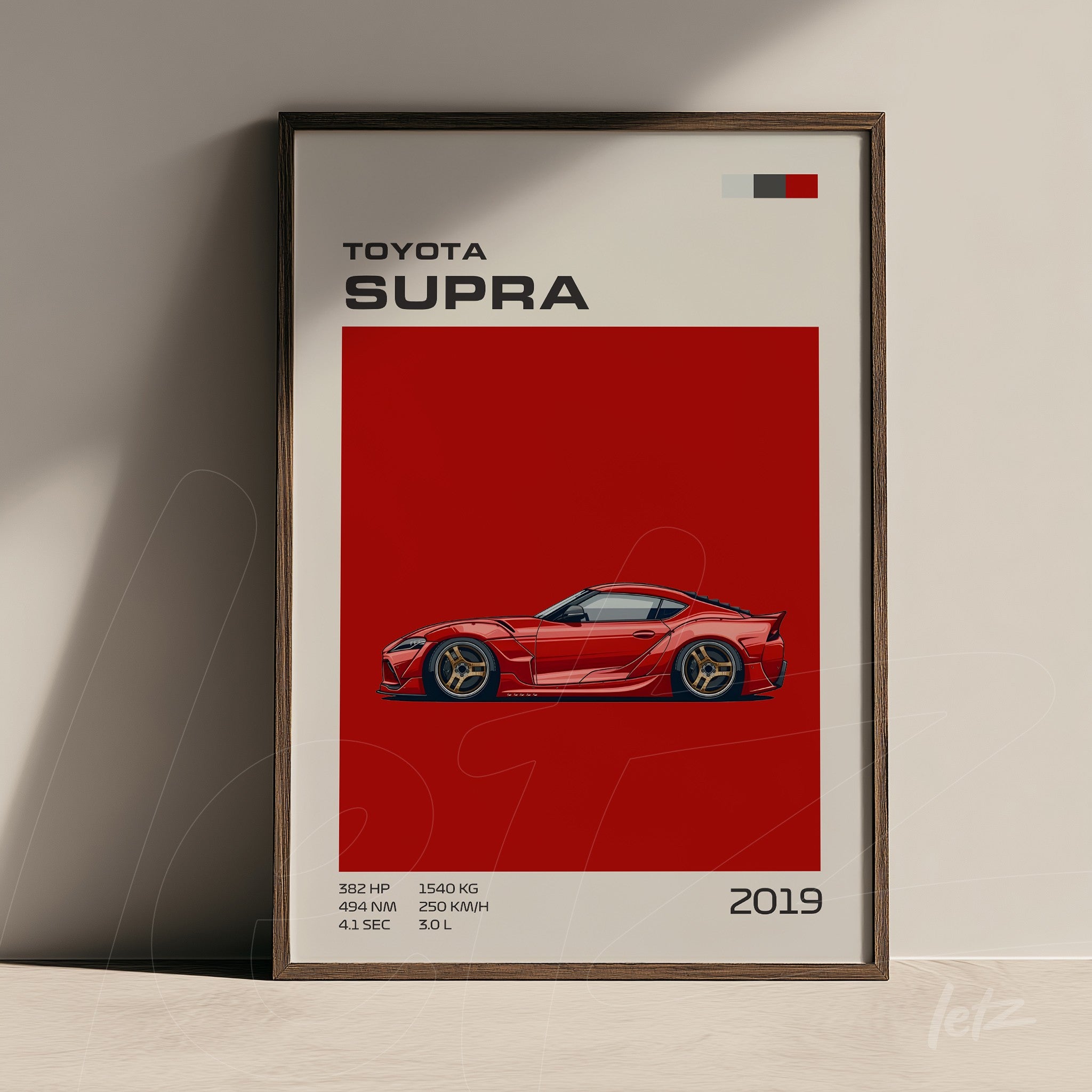 framed wall art featuring a digital illustration of the Toyota Supra in vibrant red against a bold red background with a dark wooden frame