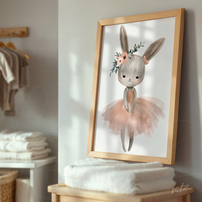 framed wall art of a ballet bunny with light wood frame, enhancing the room with stacked towels in the background