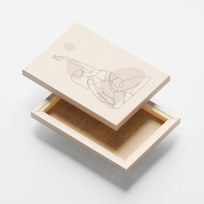 canvas print featuring continuous line art of a human figure in a yoga pose against a light background