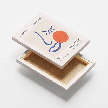 decorative box featuring modern minimalist face art on light background
