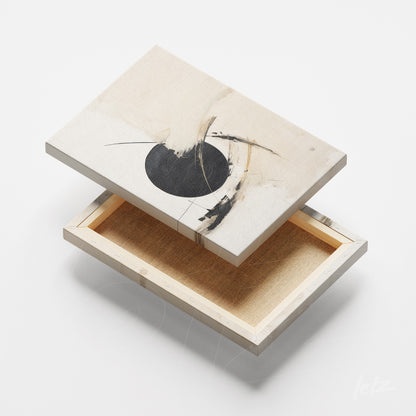 canvas art featuring abstract design in neutral tones with black circle, shown from the side to highlight the frame depth