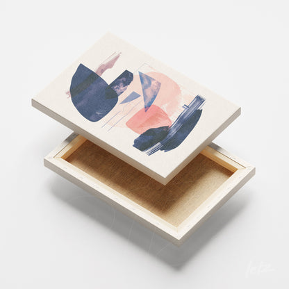 canvas print with abstract art in blue and peach tones on a light background