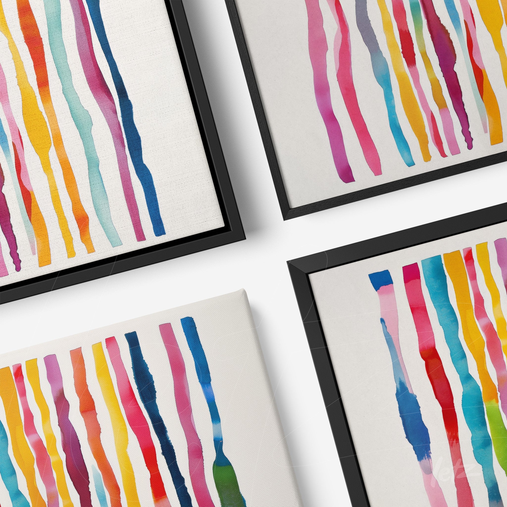 composition of framed wall art featuring abstract colorful stripes in black frames