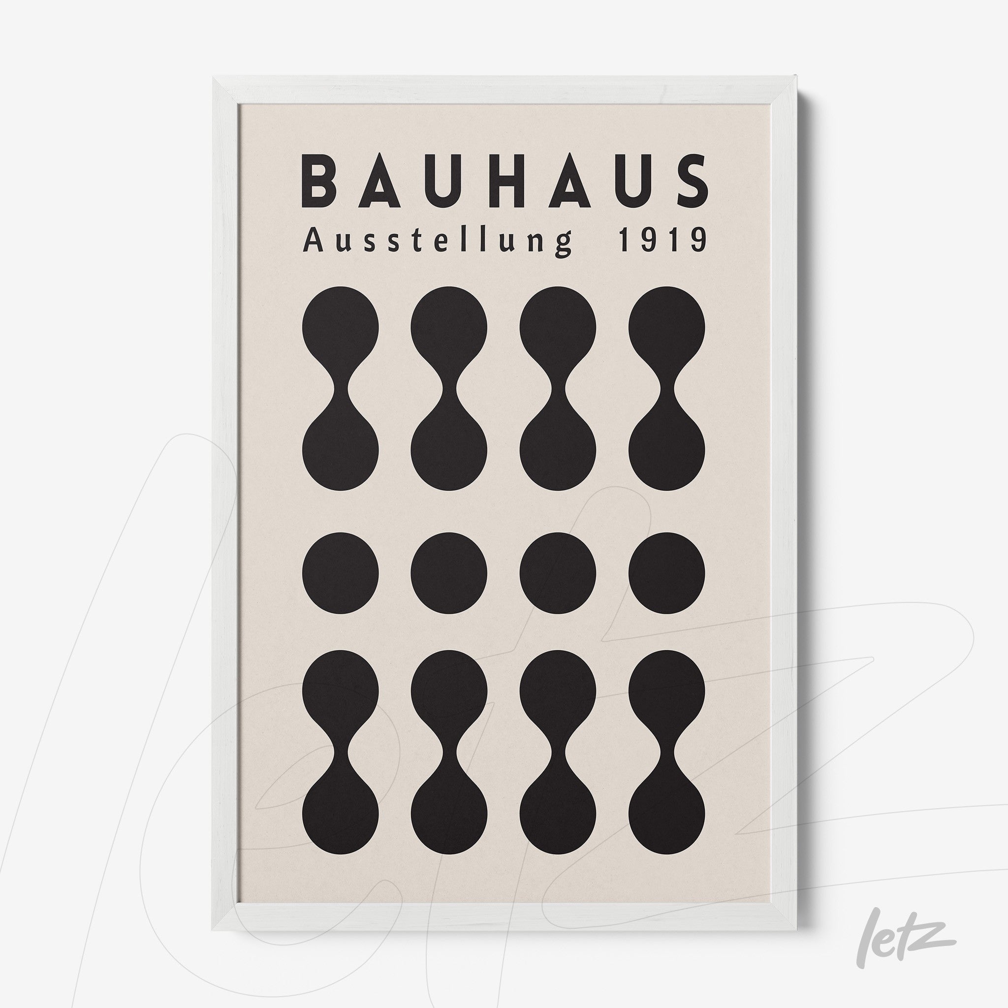 Bauhaus style poster print with black geometric shapes in a white frame