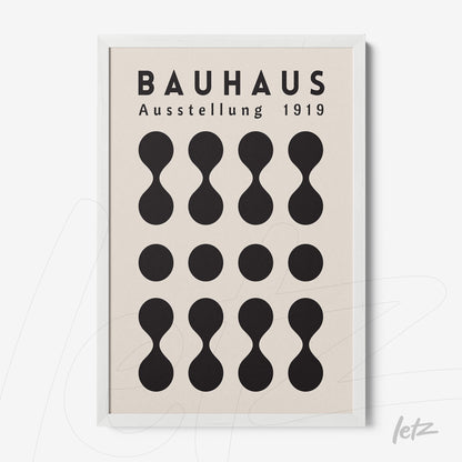 Bauhaus style poster print with black geometric shapes in a white frame