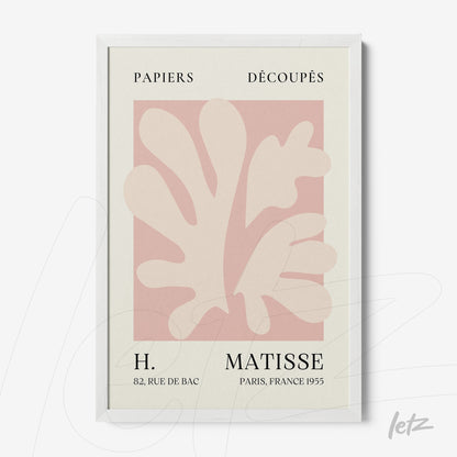framed wall art featuring paper cut-out design in light pink tones with classic typography against a cream background