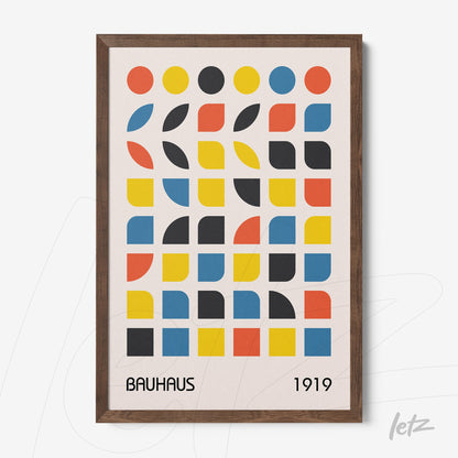 framed geometric design art in bauhaus style with colorful circles and semicircular shapes in wooden frame