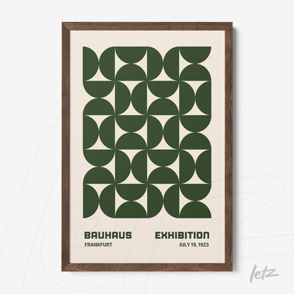 printed poster in bauhaus style with green geometric shapes framed in dark wood