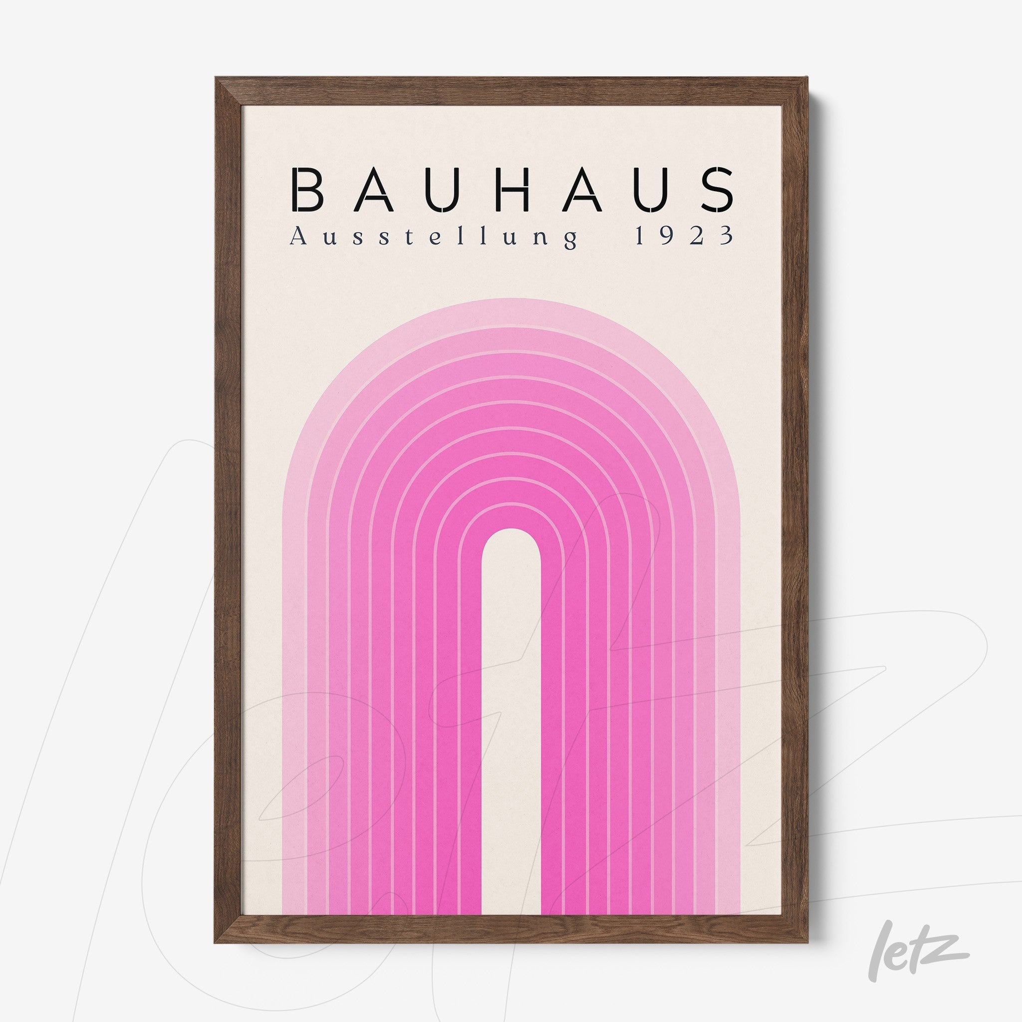 framed art featuring a pink arch design on a beige background with dark wood frame