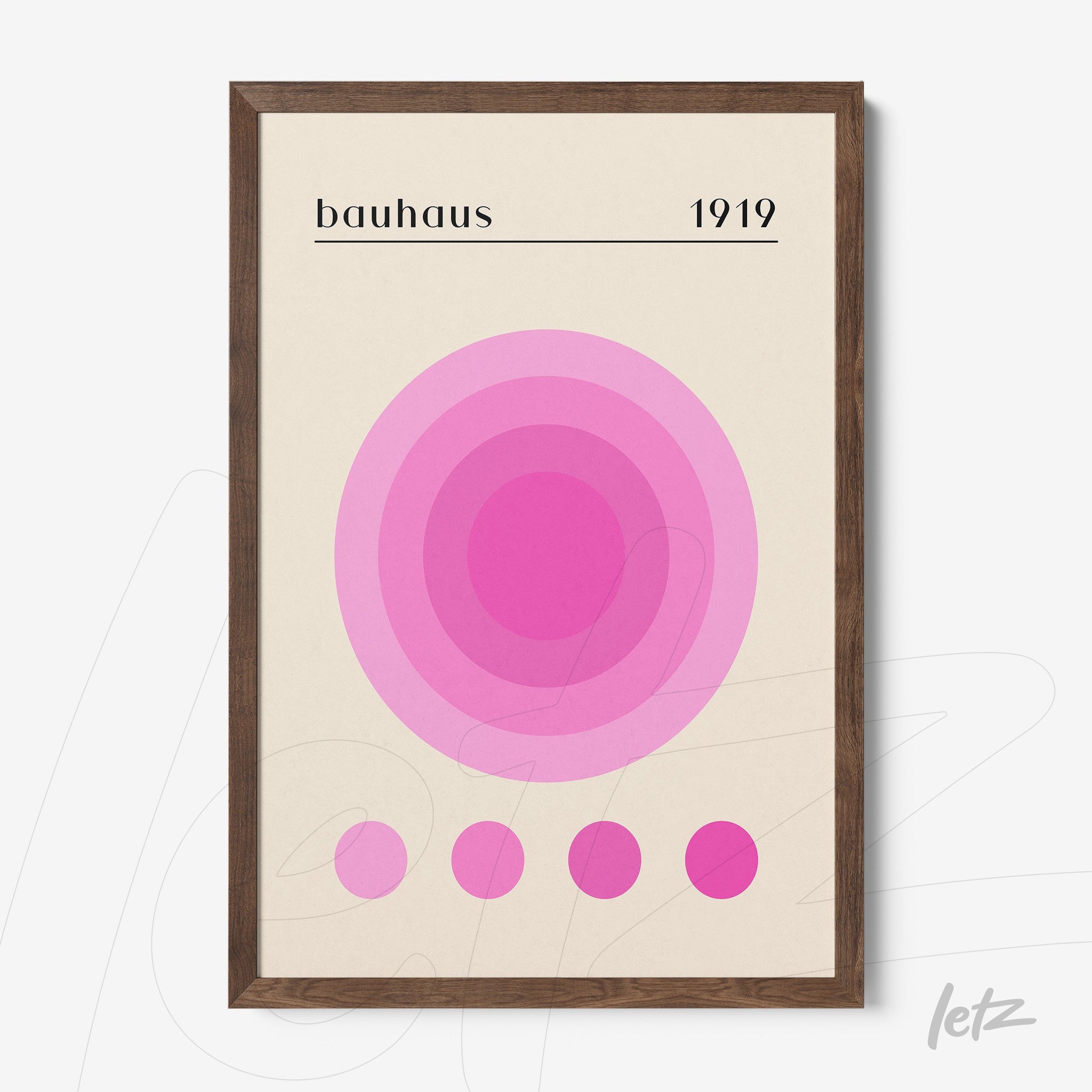 bauhaus style poster print with pink circles and wooden frame