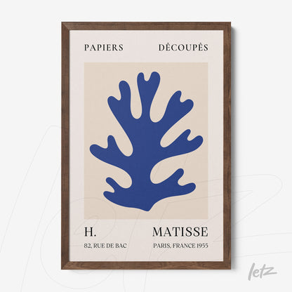 contemporary wall art featuring a blue coral design on a light background, framed in dark wood