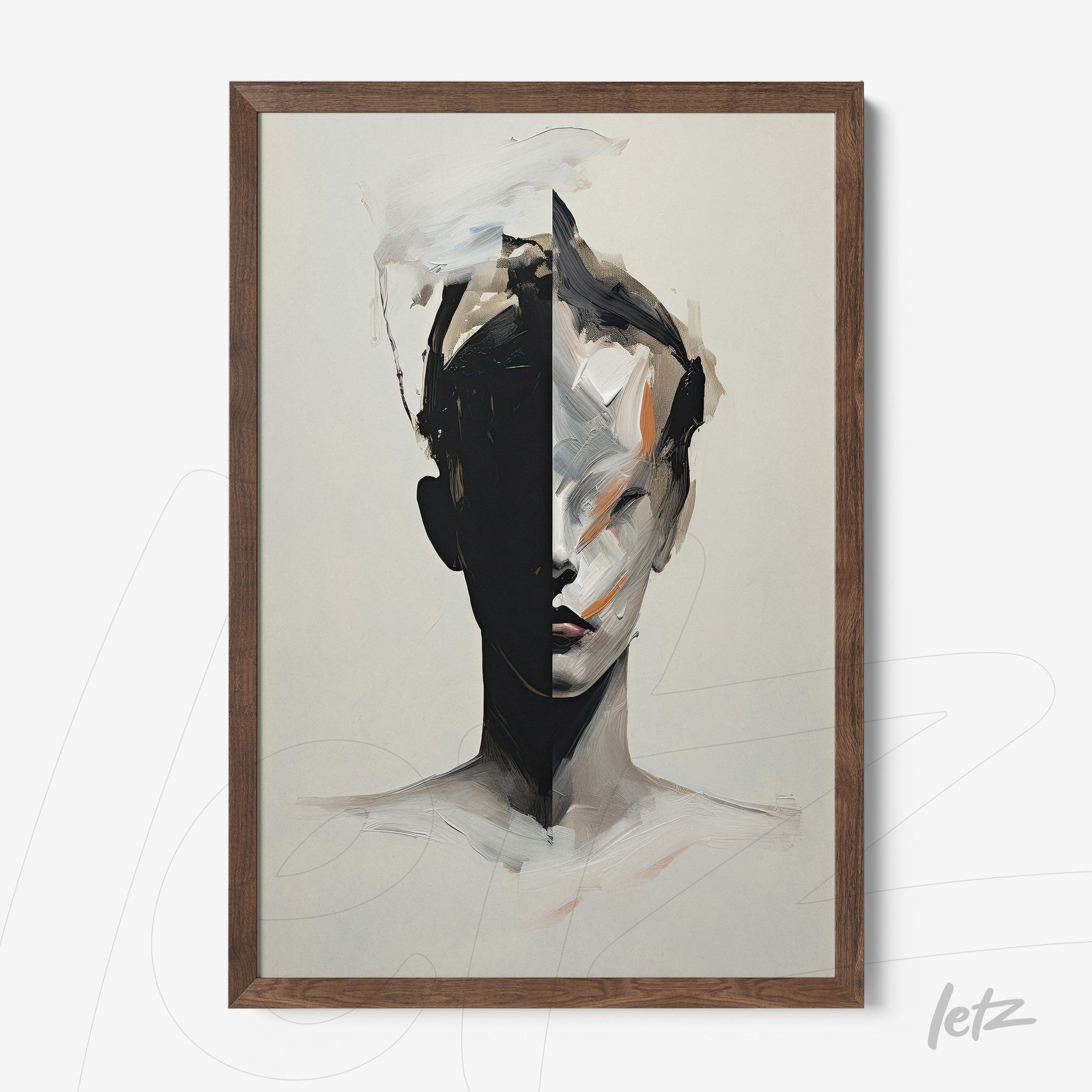 framed abstract artwork of a human face split into light and dark tones with a dark wood frame