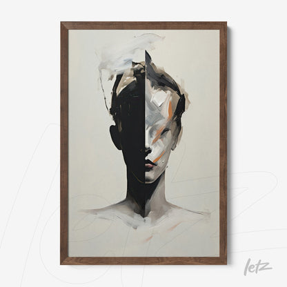 framed abstract artwork of a human face split into light and dark tones with a dark wood frame