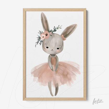 framed wall art featuring a ballerina bunny wearing a pink tutu and adorned with flowers in her hair with a light wood frame