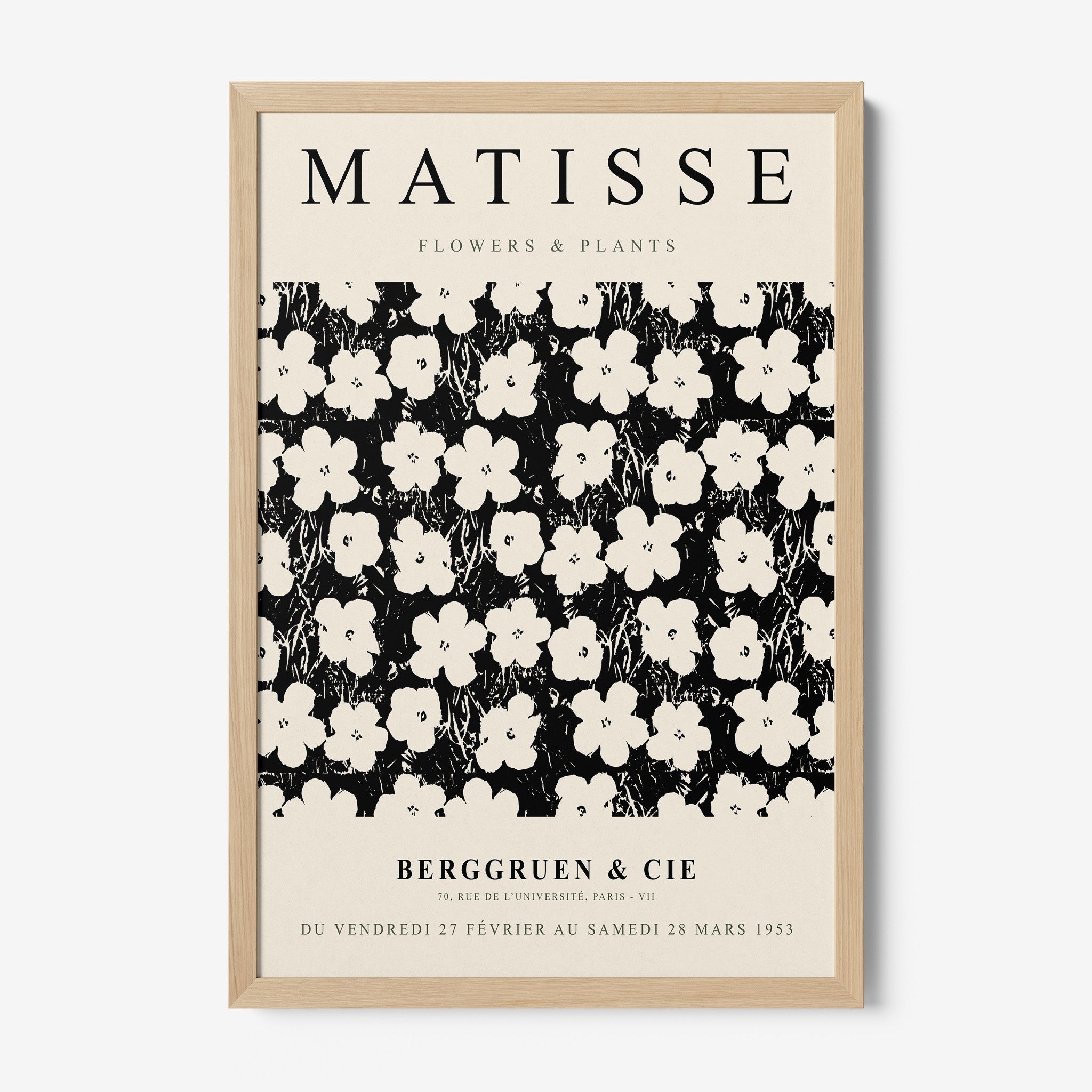 framed artwork featuring floral patterns in black and white with a light wood frame and stylized flower designs