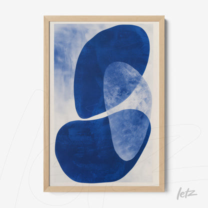 abstract wall art in shades of blue on light background with light wood frame