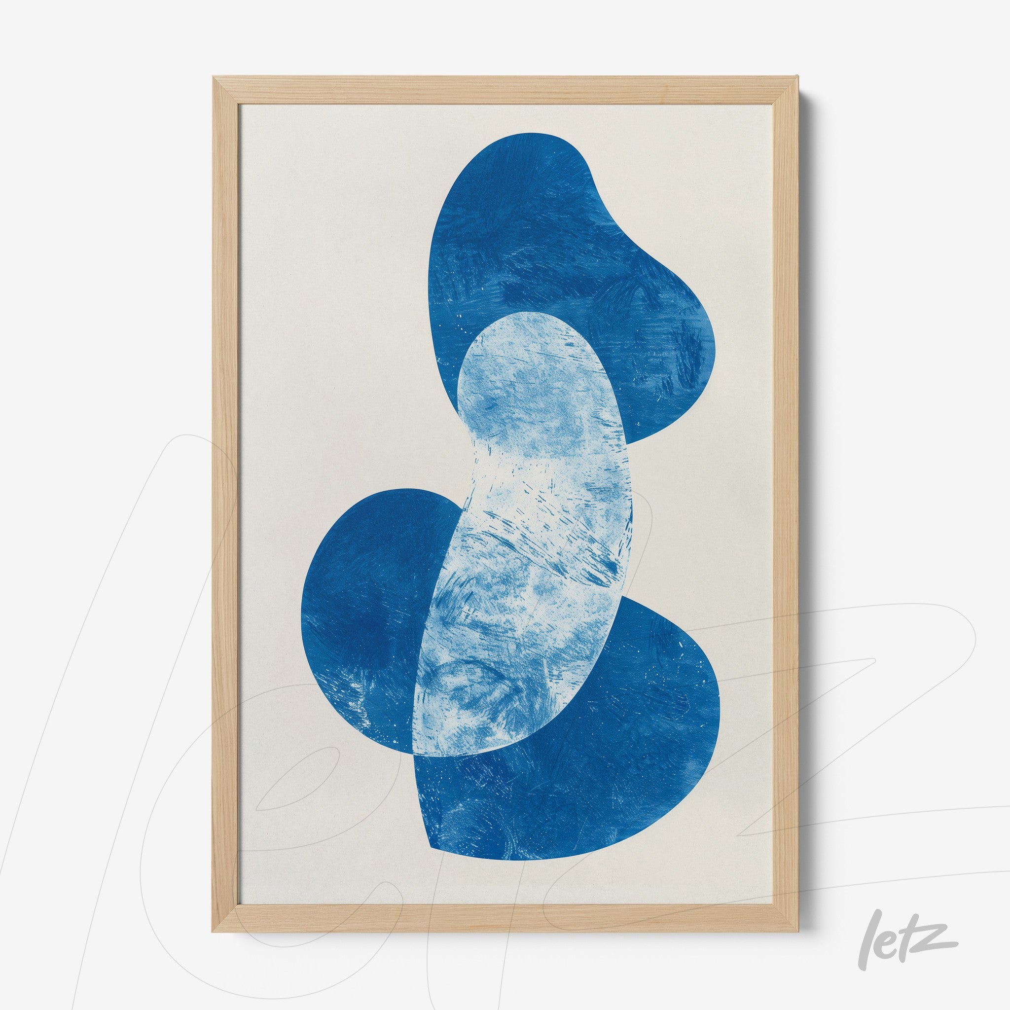 abstract artwork in blue featuring organic shapes framed with a light wood frame