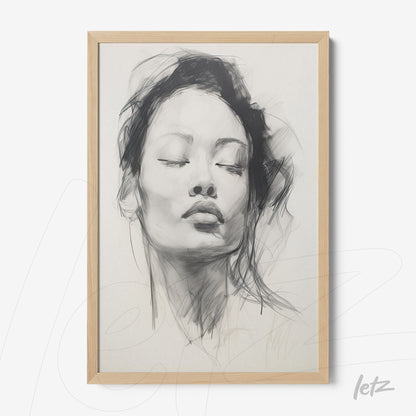 framed black and white portrait of a serene woman in light wooden frame