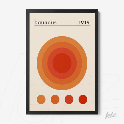 artwork featuring concentric circles in shades of orange and red with a black frame