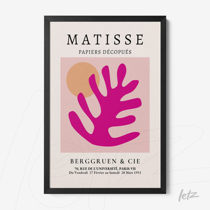 framed modern abstract art featuring a pink leaf shape on a light background with black frame