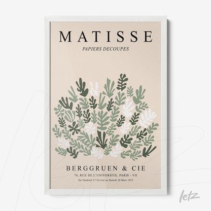framed modern art print featuring leaves on a beige background with a white frame