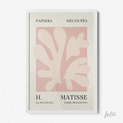 framed wall art featuring light-toned paper cutouts on soft pink background