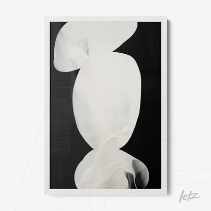 framed abstract art in light tones set against a black background