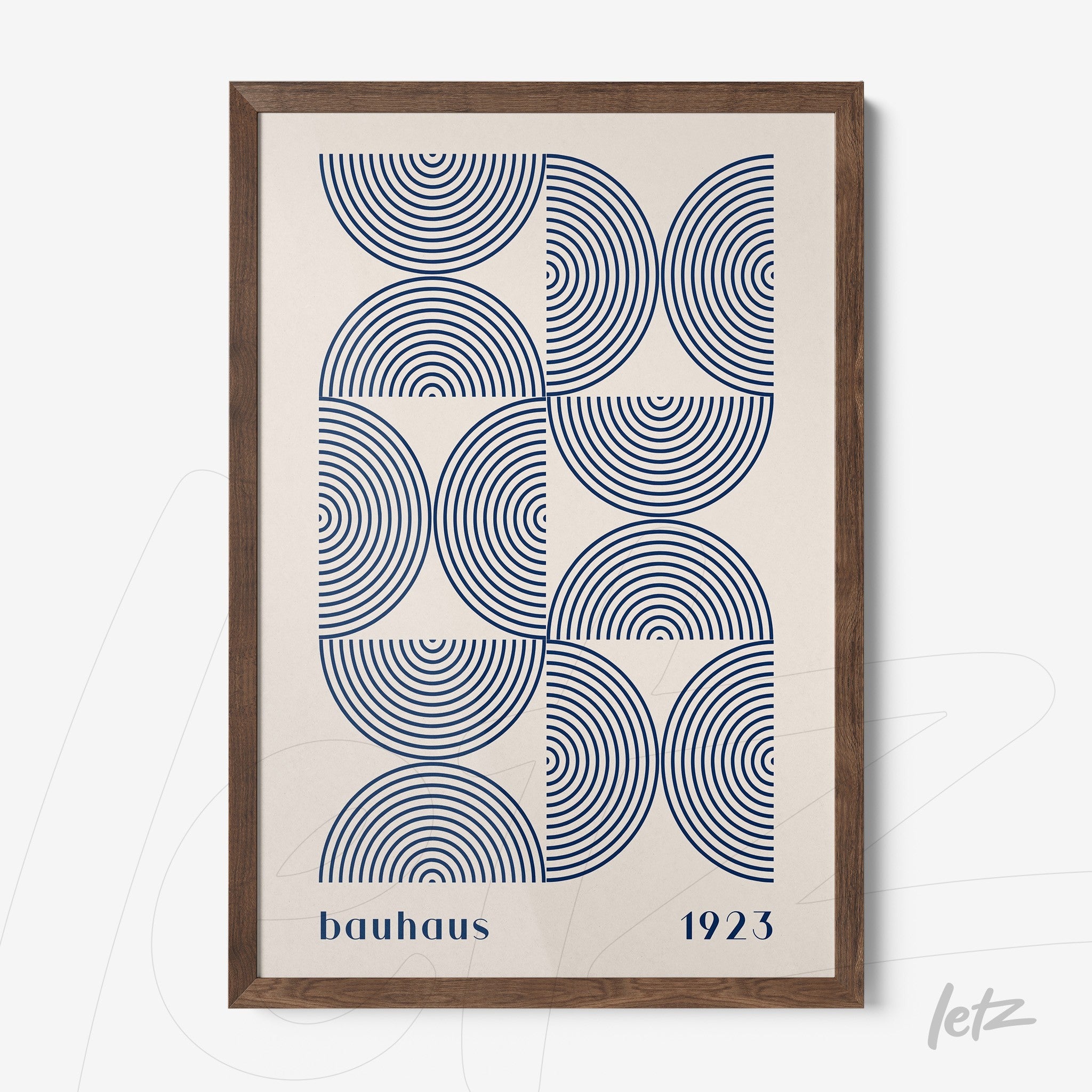 framed wall art featuring blue concentric circles pattern with dark wood frame