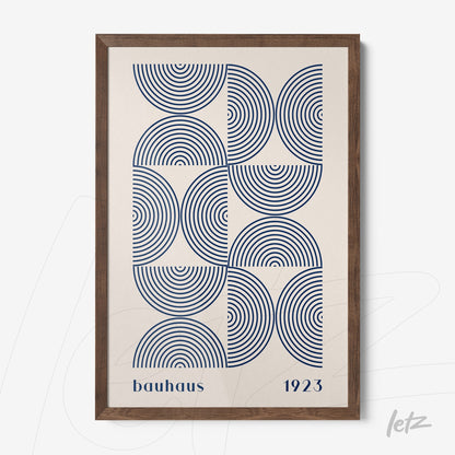 framed wall art featuring blue concentric circles pattern with dark wood frame