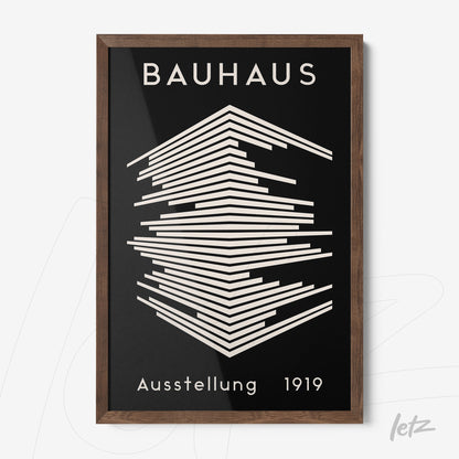 poster featuring graphic art of the Bauhaus movement within a dark wood frame
