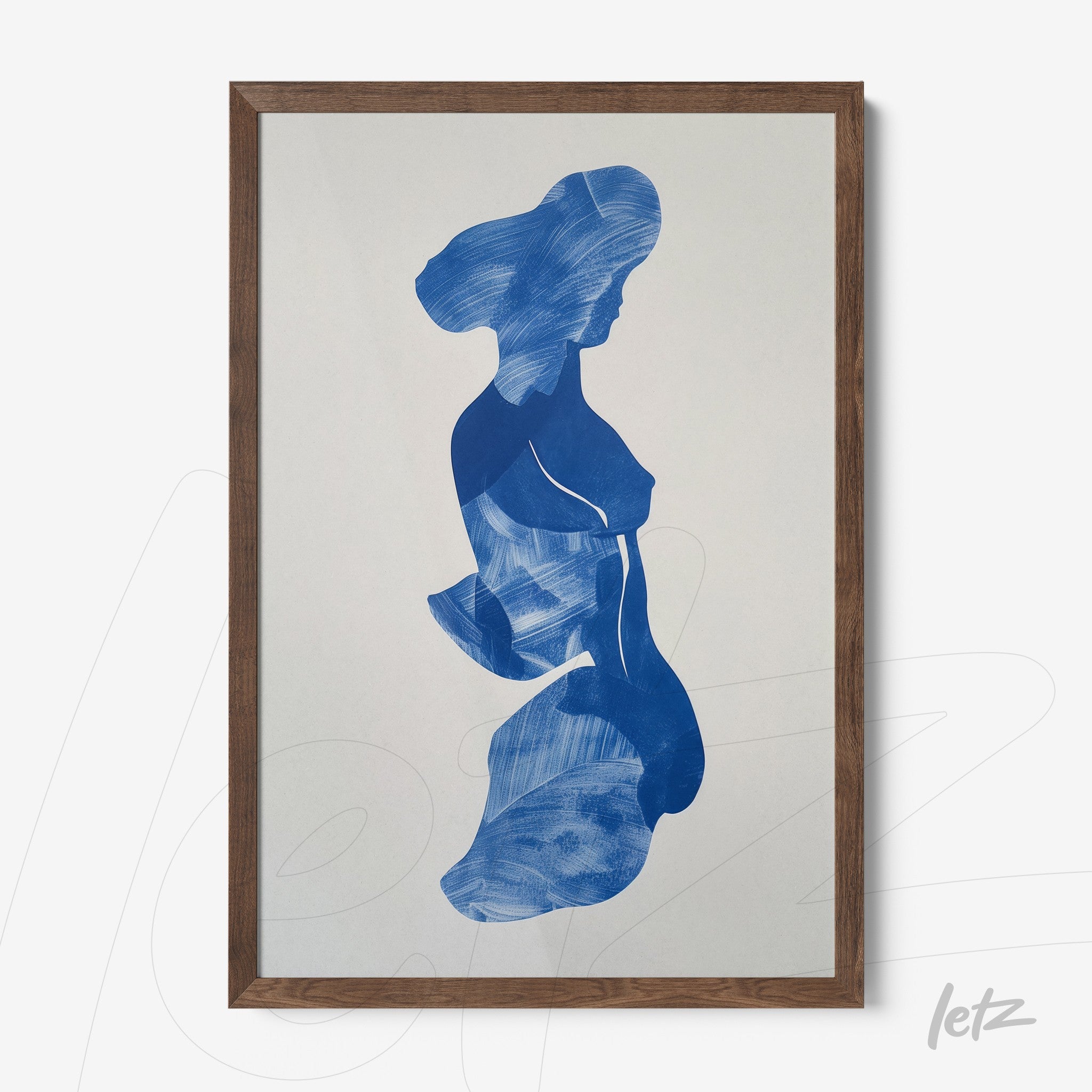 framed abstract art piece featuring a blue silhouette of a woman in dark wood frame