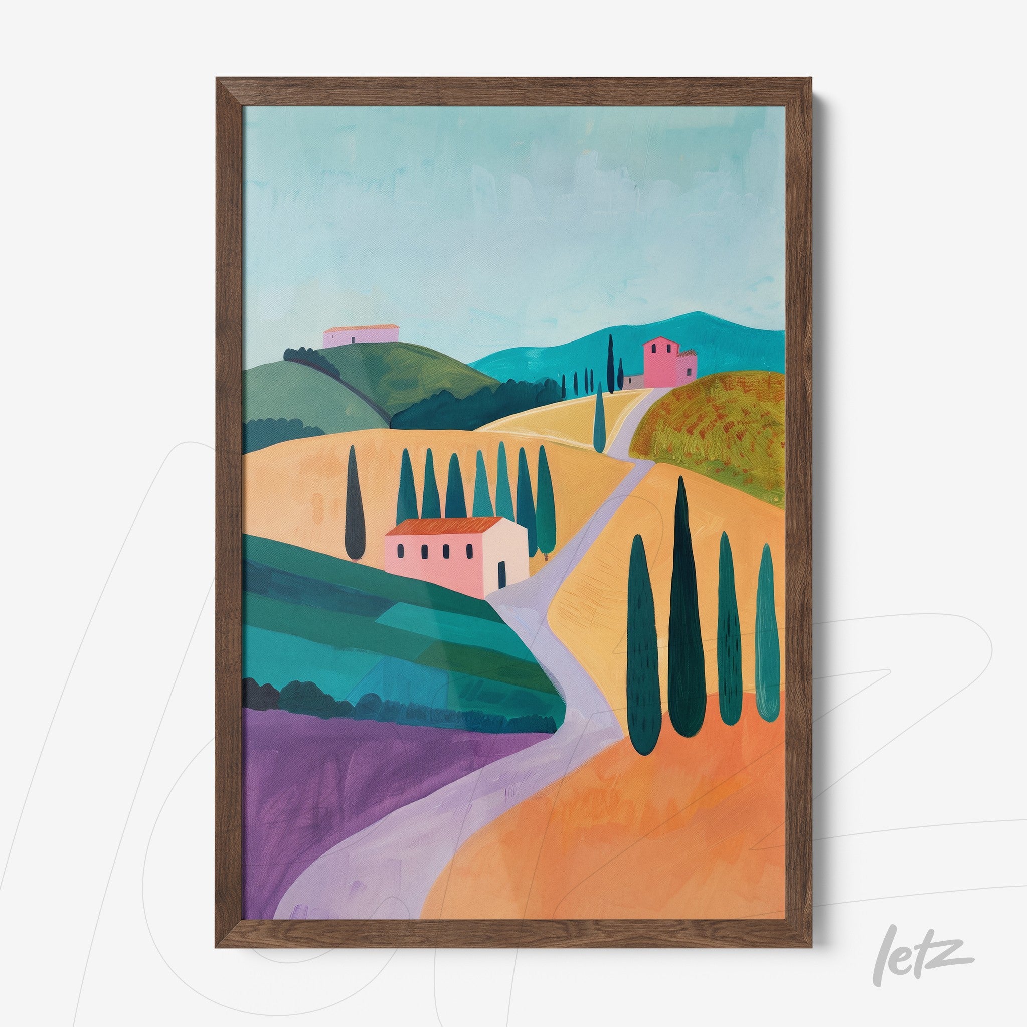 framed wall art featuring a stylized countryside landscape with colorful houses and cypress trees along a winding path