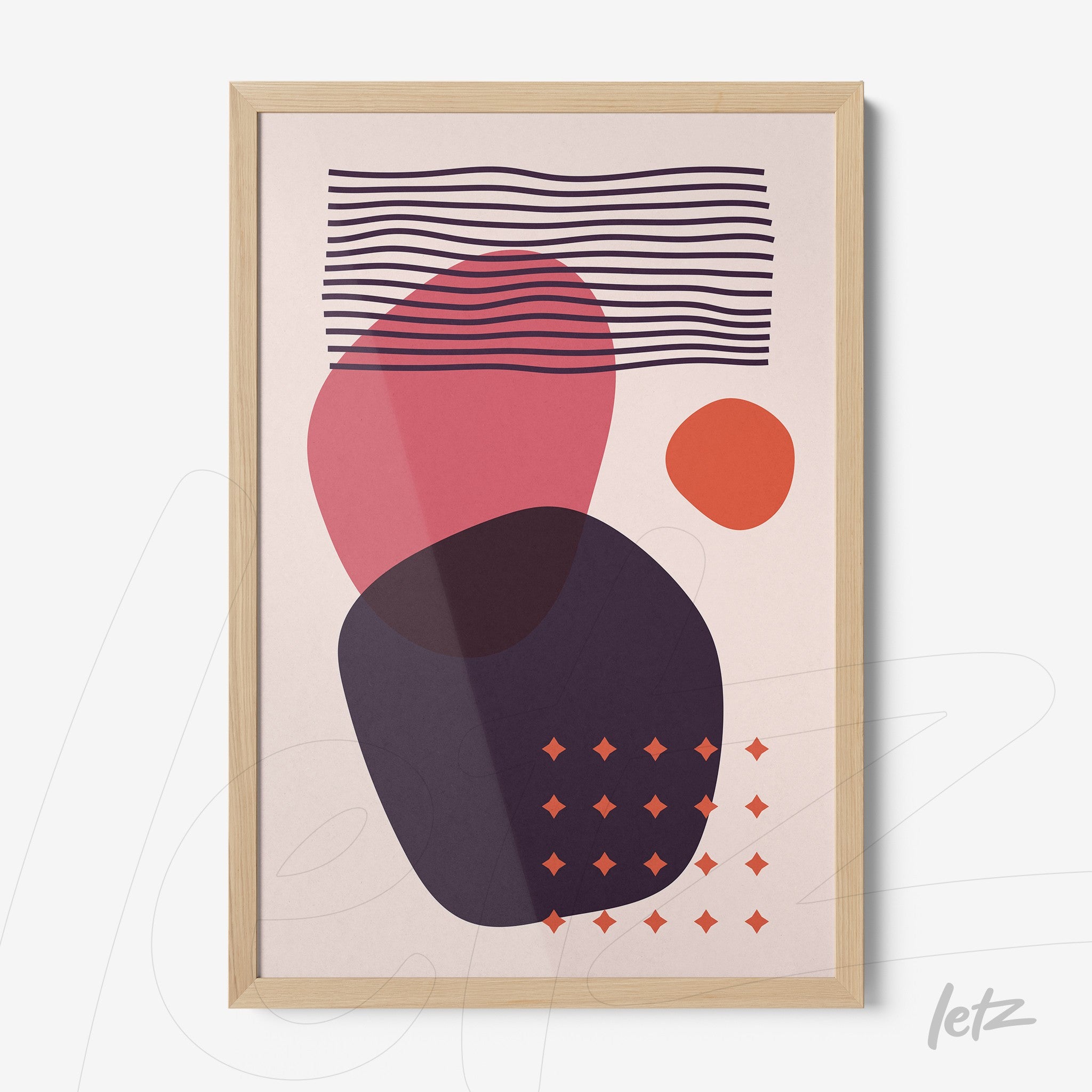 abstract geometric wall art in light wood frame, featuring red and lilac shapes on a light cream background