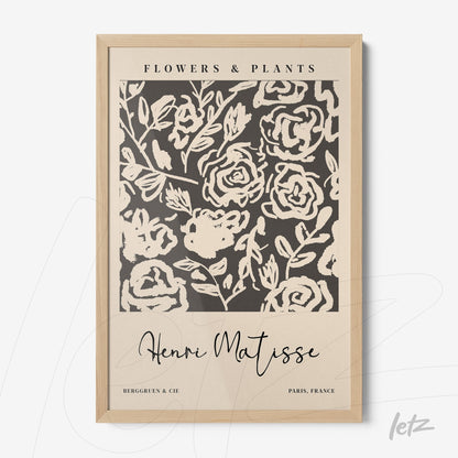 decorative wall art featuring abstract flower design on dark background with light wood frame