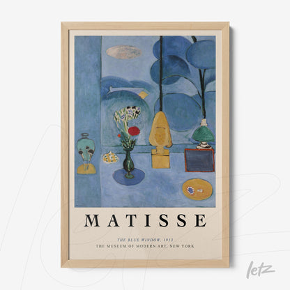 framed art piece by Henri Matisse titled 'The Blue Window' in light wood frame