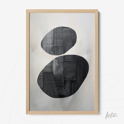 abstract art print in black and white framed in light wood