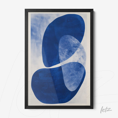 framed abstract art piece in shades of blue with black frame