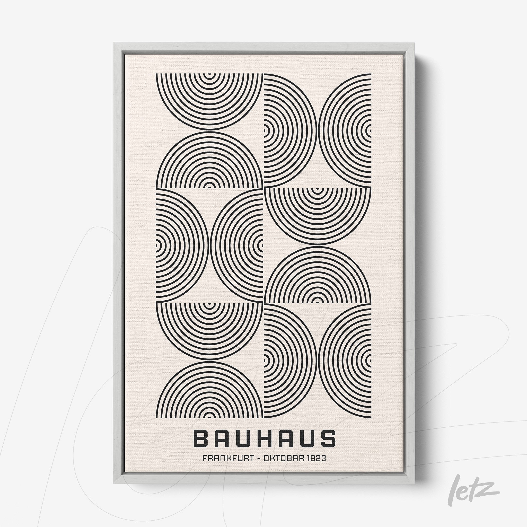 modern Bauhaus style poster with black concentric circles on a light background, displayed in a thin gray frame
