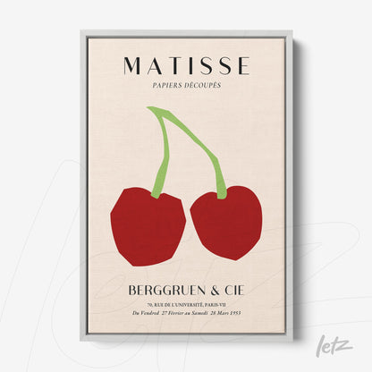 framed abstract art with red cherries and green stems on a light background