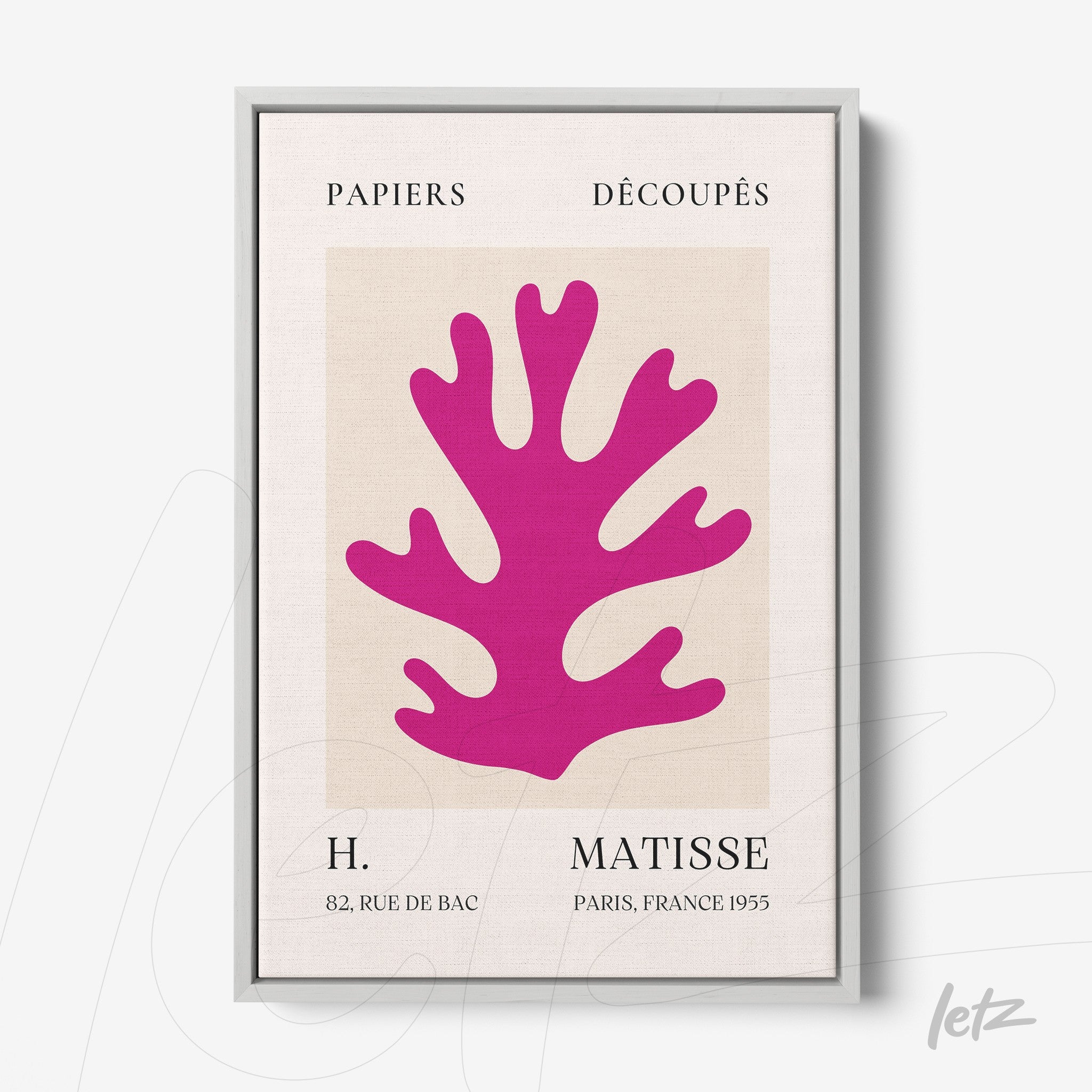 framed wall art featuring paper cutouts of a large pink coral on a light background with a silver frame