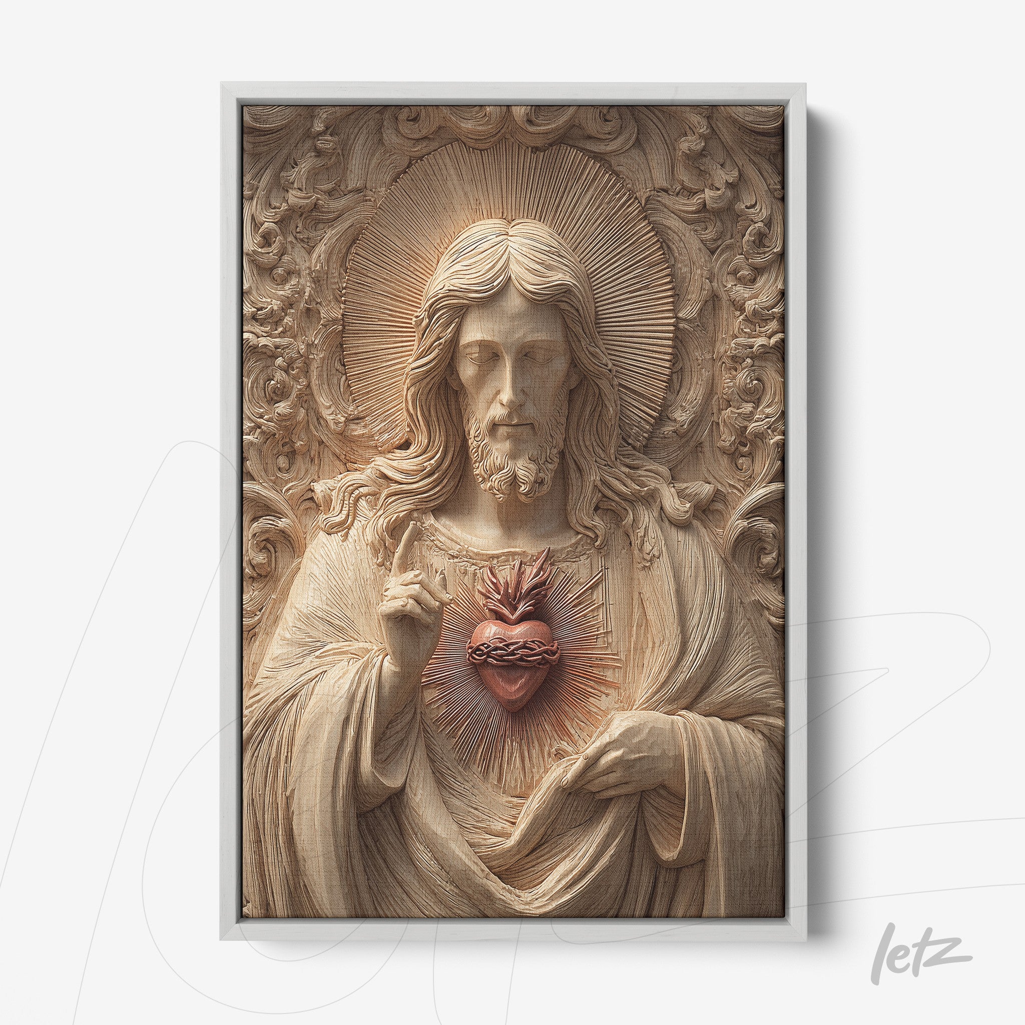 three-dimensional wall art of Christ with the Sacred Heart, framed in white with decorative relief background