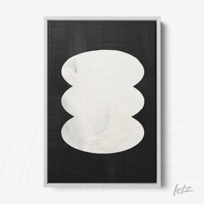 modern wall art featuring black background and white organic shapes framed in light color