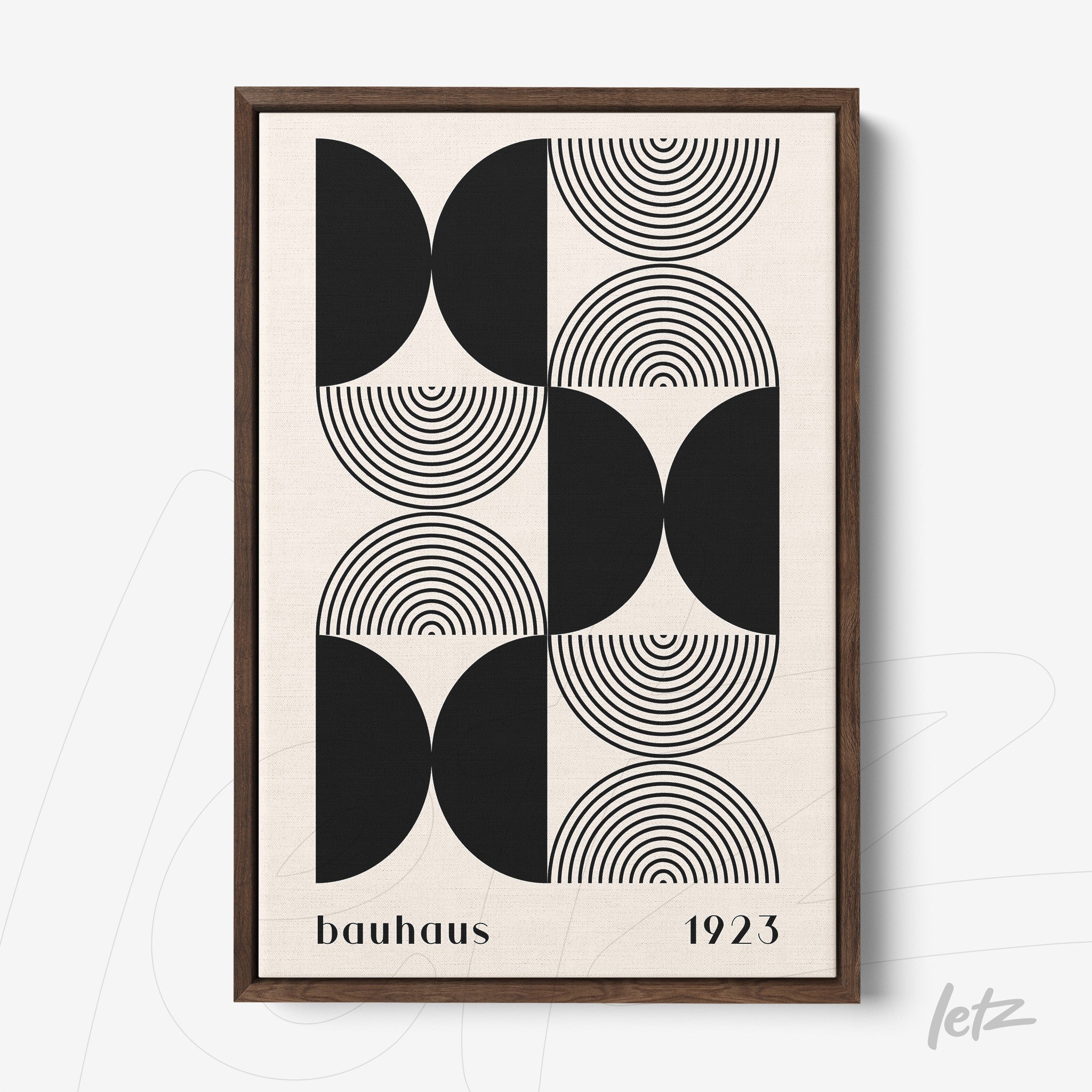black and white geometric Bauhaus style art in dark wood frame